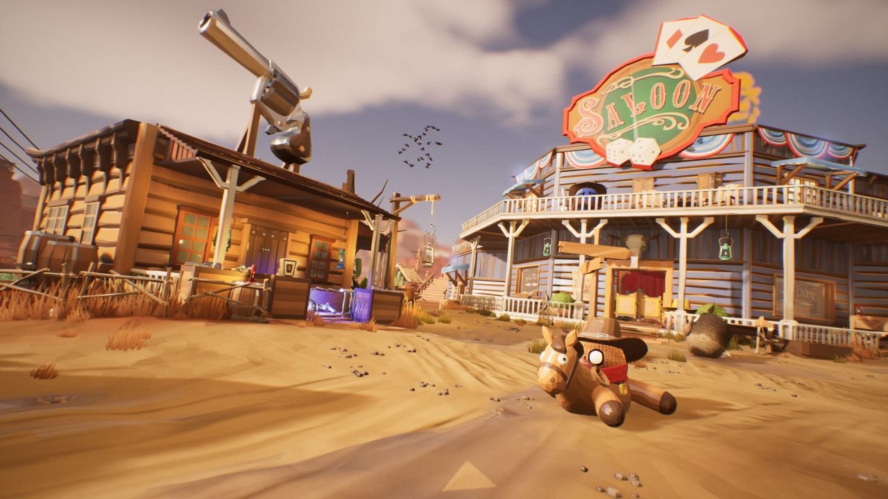 A ball wearing a cowboy hat sits on a collapsed horse doll in front of a saloon in the Wild West.