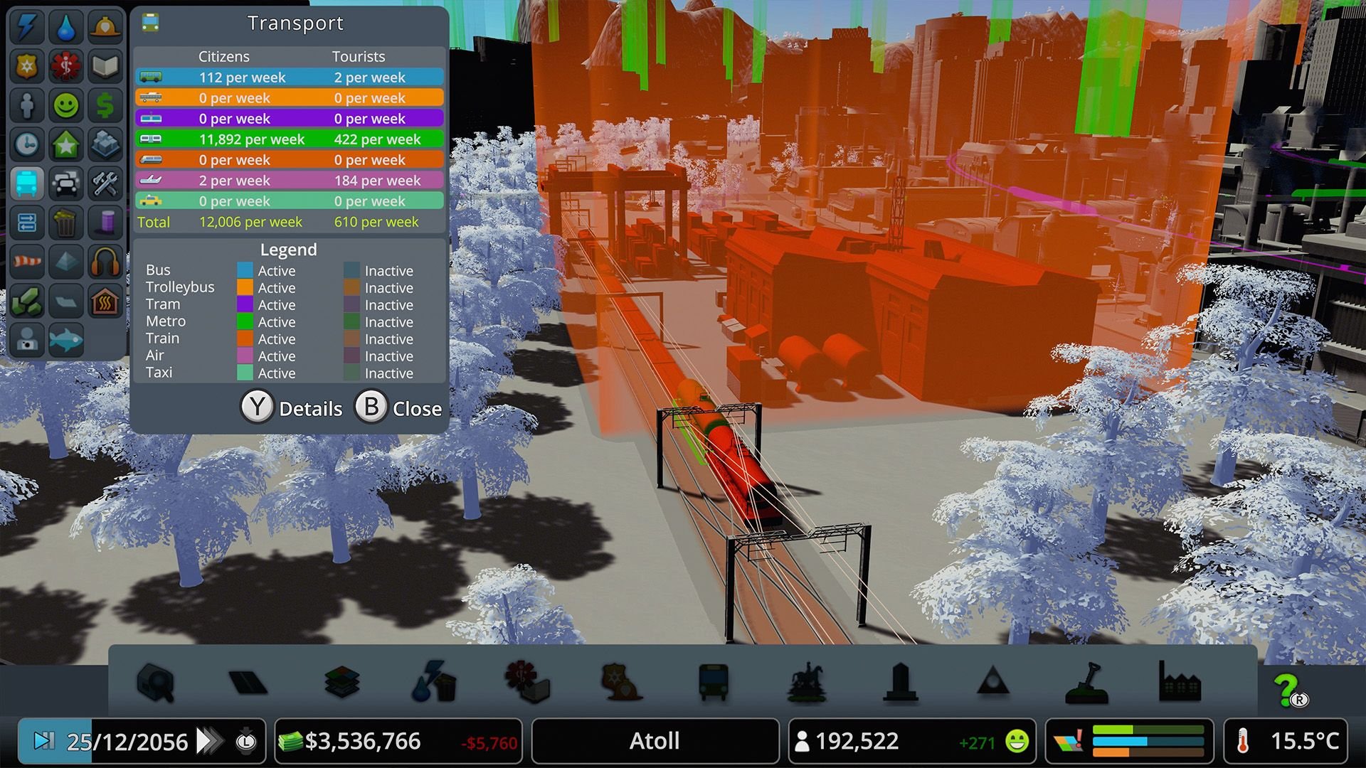 A gameplay screenshot showing some tracks with a train on it, and red buildings in the background.