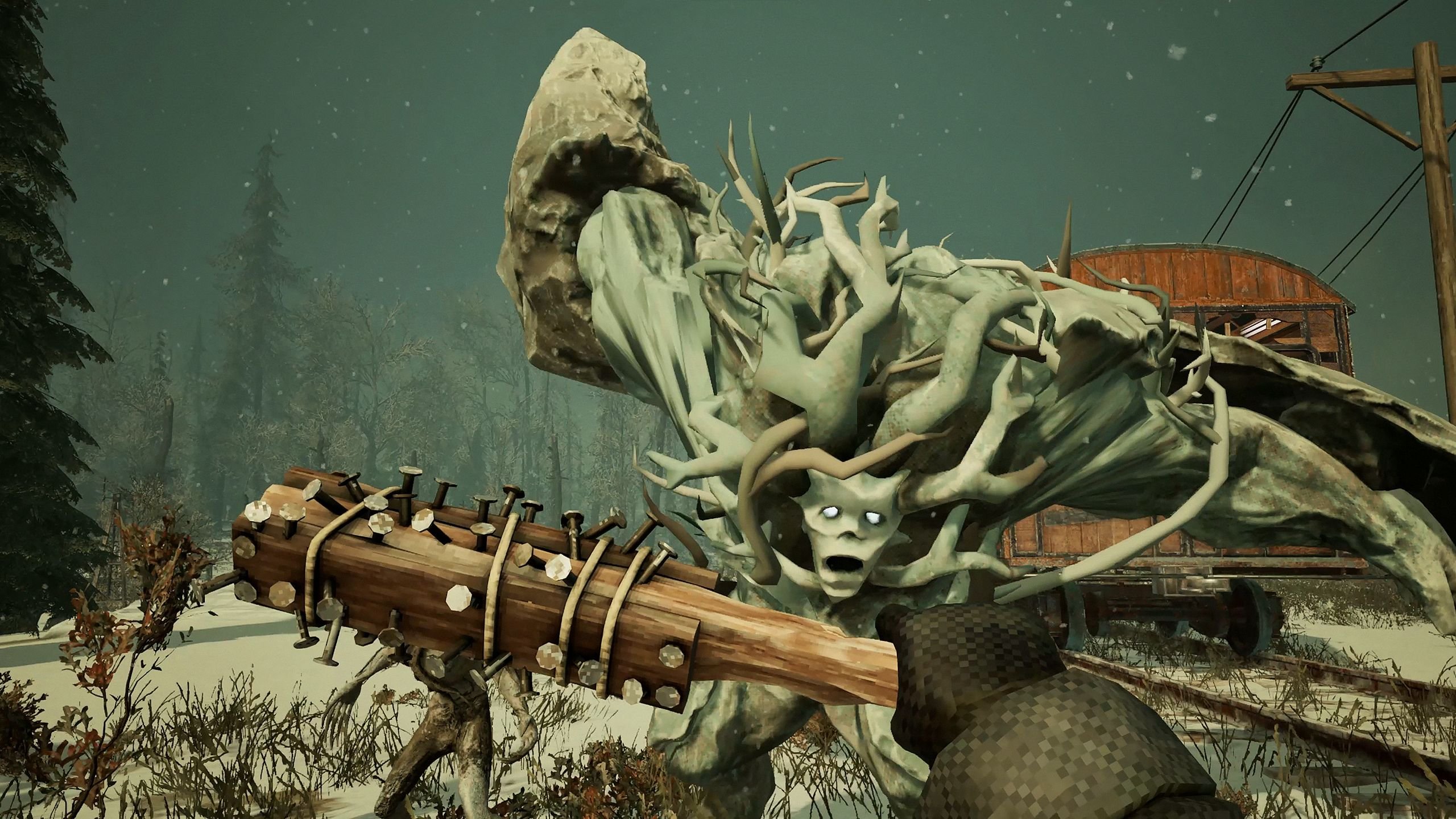Armed with a club with nails in it, the protagonist fends off an advance by monsters with vine-like hair.