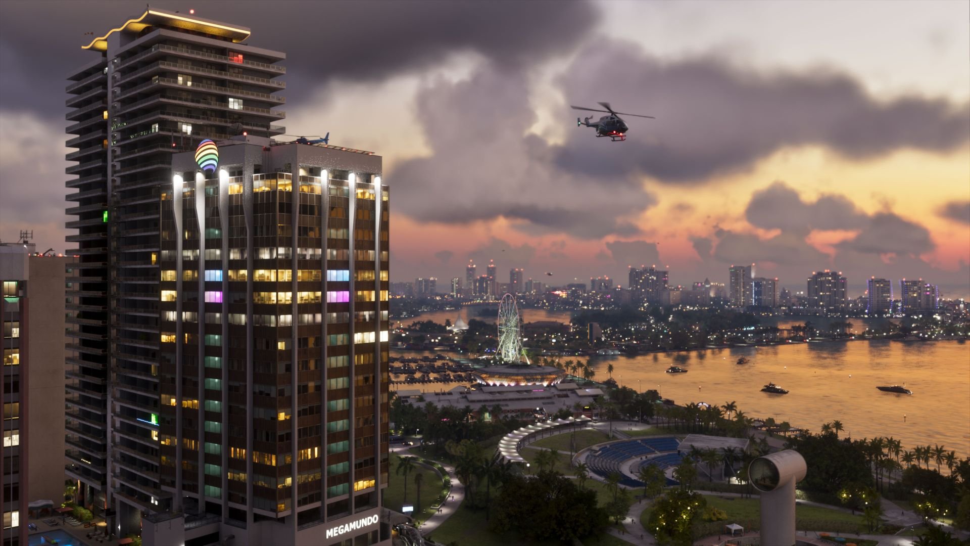 An image from GTA6 shows a Vice City skyline at dusk, with a helicopter flying right and a skyscraper in the foreground.