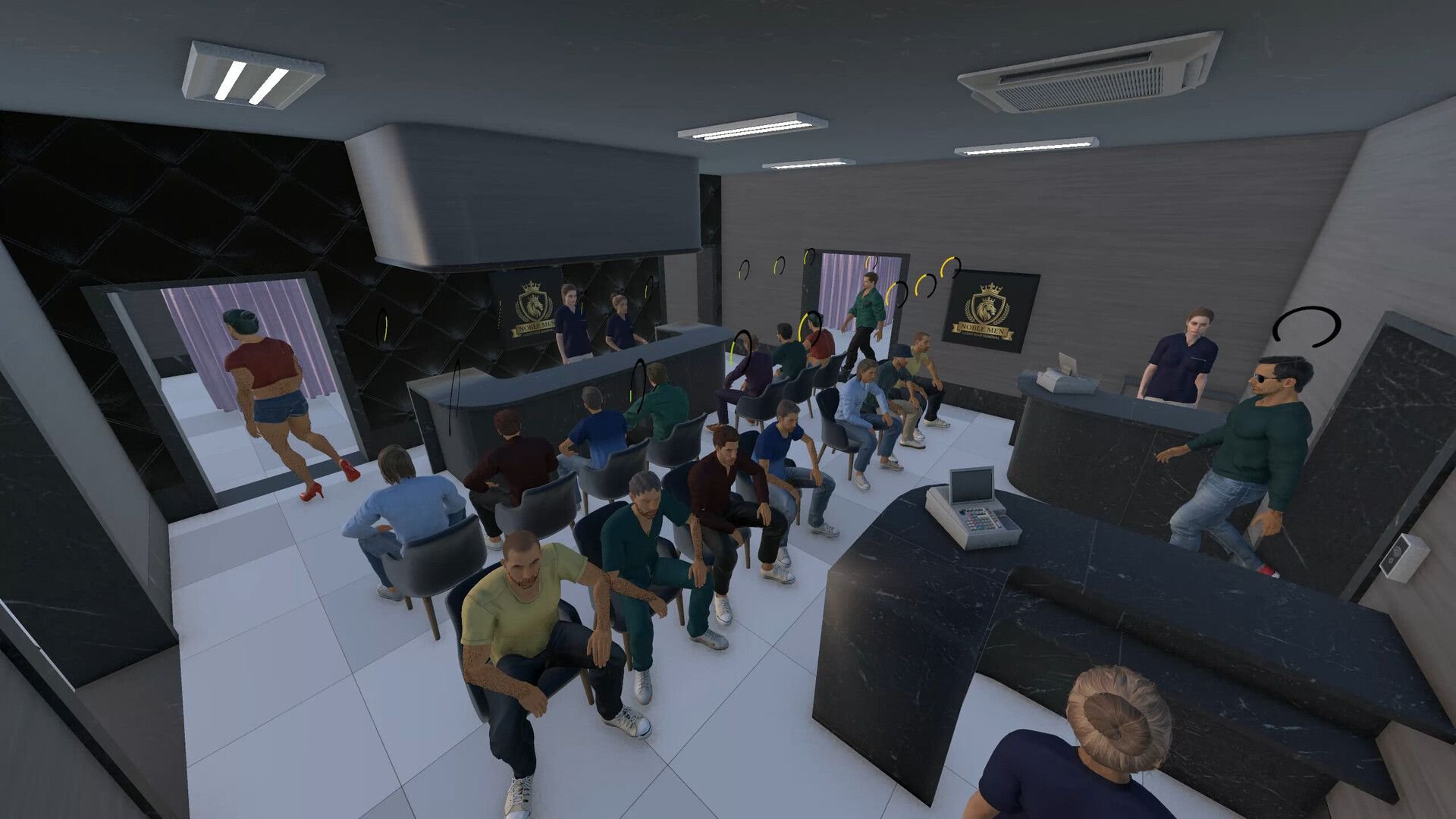 Patrons crowd a lobby with two rows of chairs, while attendees stand behind the surrounding desks.