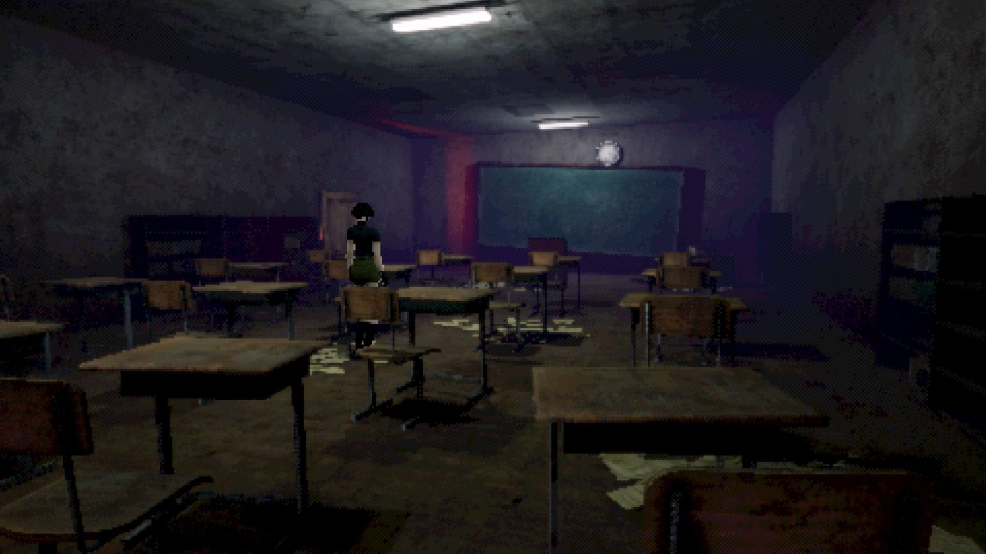 A woman stands among old-fashioned desks in a darkened classroom.