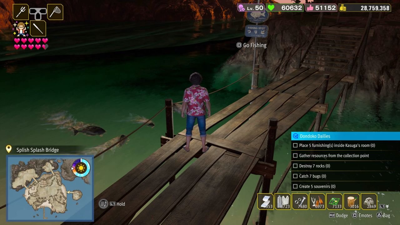 Fishing off Splish Splash Bridge at night as fish swim in the water