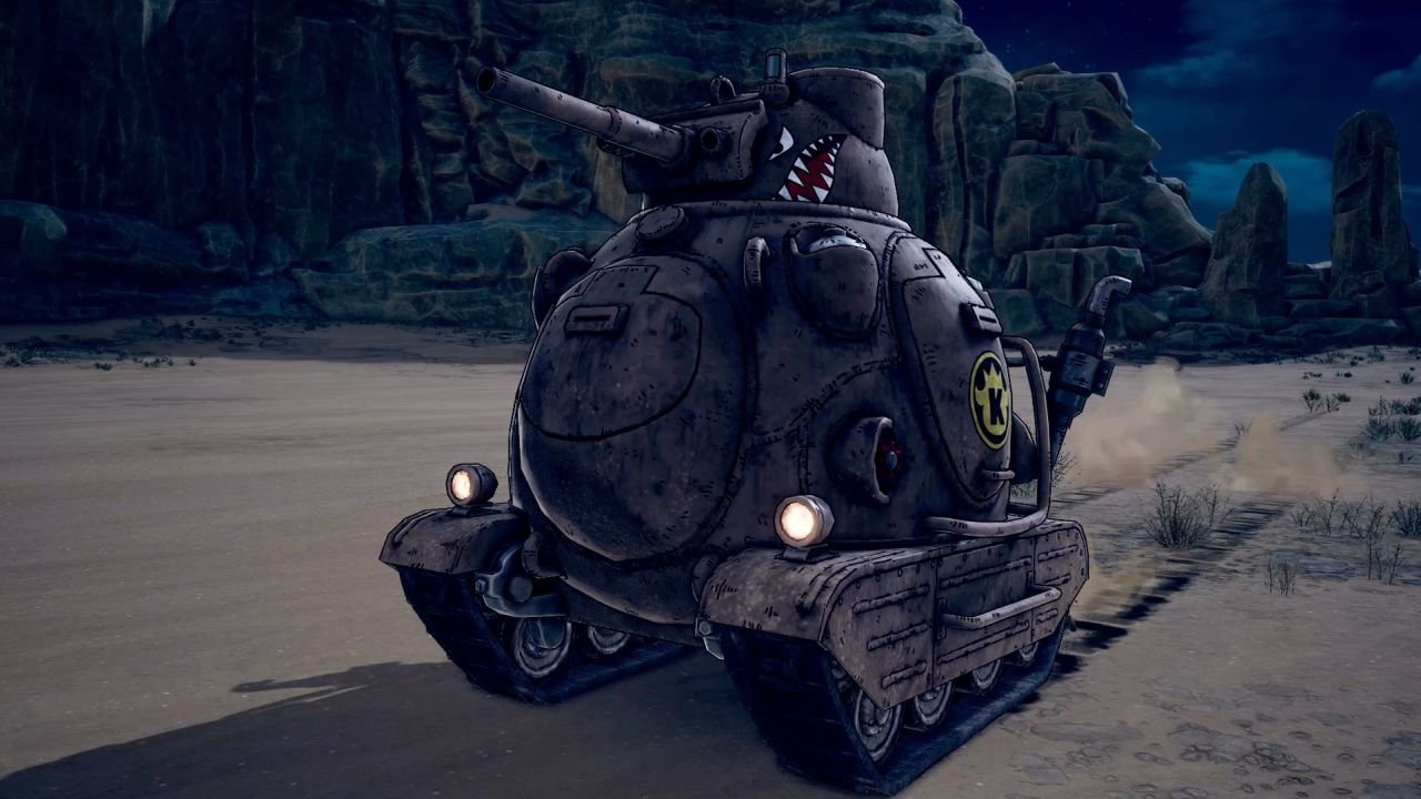 The tank rolls toward the screen, menacing, with tracks in the sand behind it.