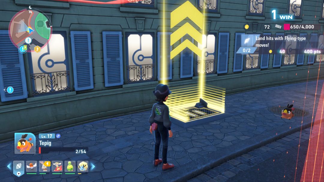 Looking toward the wall of a building in the Battle Zone, where a Holovator is active to take the player to the rooftop for some battles.