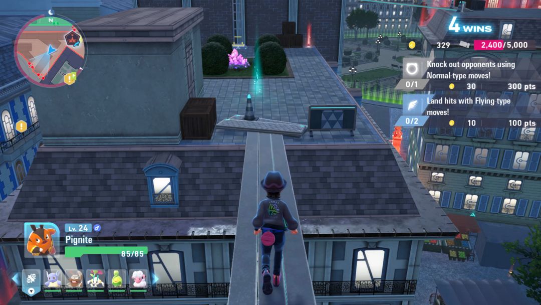 In the Battle Zone at night, the Pokemon Trainer heads from one roof to the next while balancing on boards that are stretched between them.