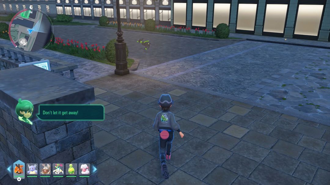 The Pokemon Trainer chases the dog-like Zygarde through the streets as it veers left around a light pole.