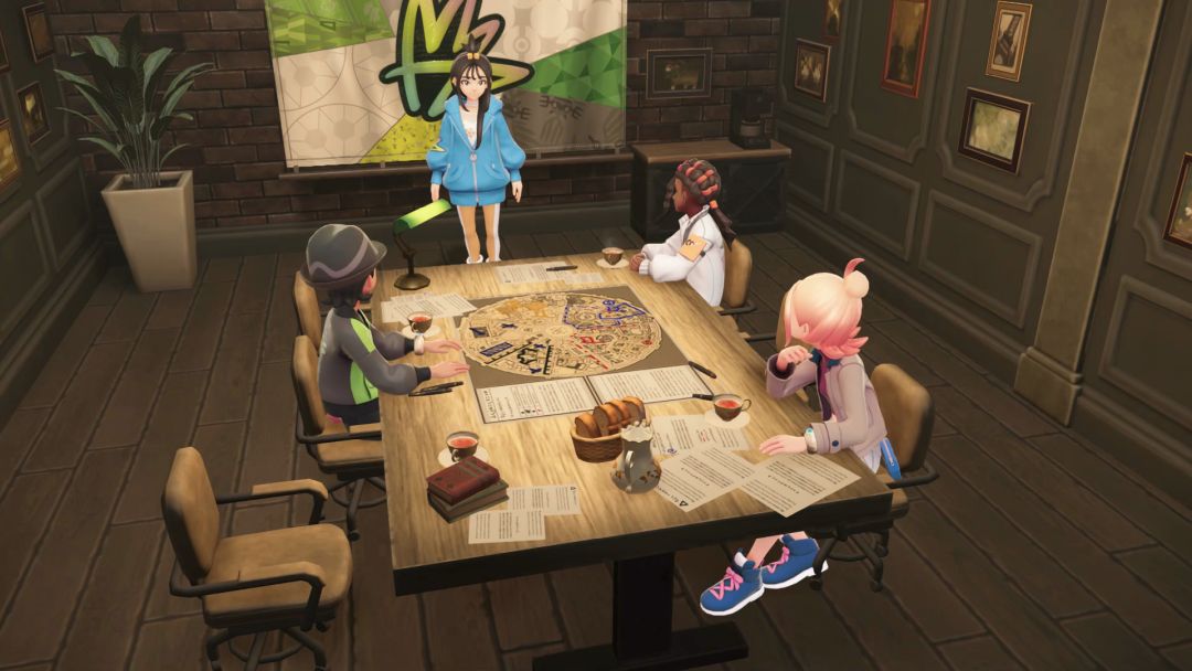 Lida stands at the head of a table while her Team MZ friends sit facing her and listening to her advice.