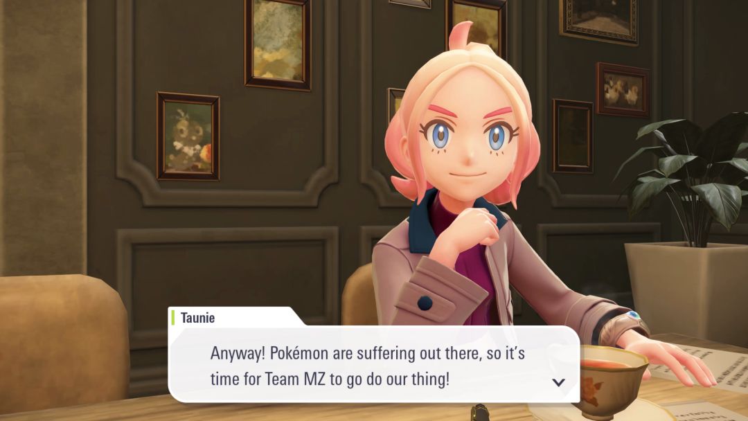 In the strategy meeting, seated at the table, Taunie says Team MZ needs to do its thing to help avoid Pokemon suffering.