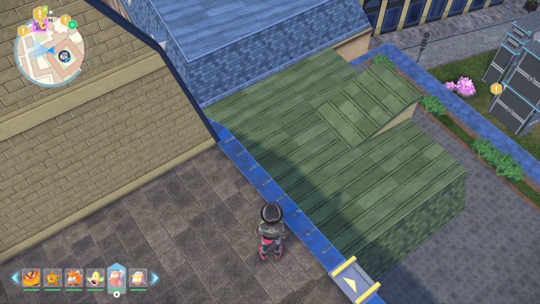 Having just climbed a ladder near where he last met with Taunie, the Pokemon Trainer looks down at a green rooftop and prepares to jump to it.