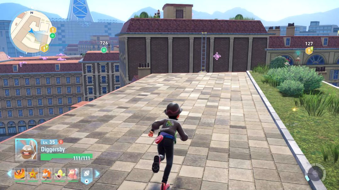 The Pokemon Trainer runs along a roof toward the next ladder, positioned along the side of building with another utility building.