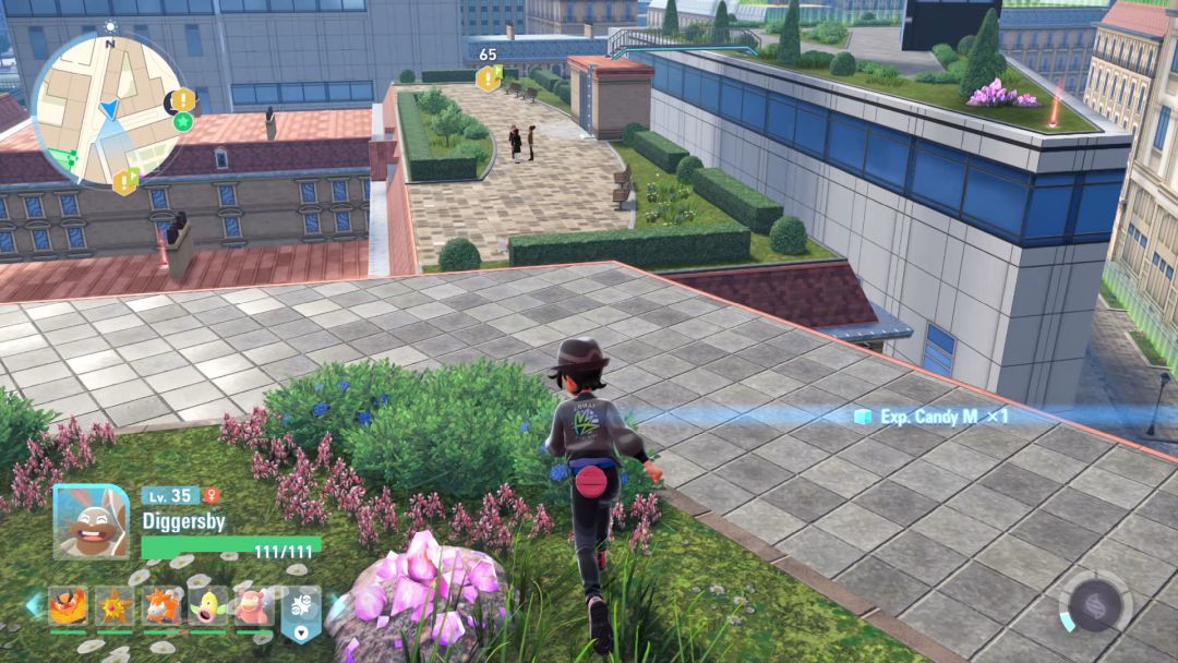 The Pokemon Trainer heads toward the edge of a rooftop and views an open area ahead, where people stand among a shrub garden.