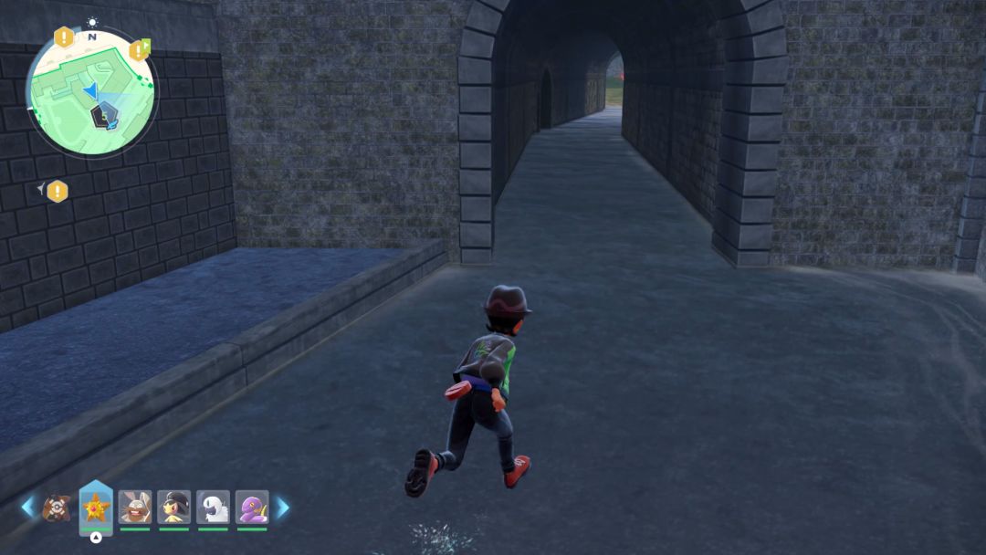 The Pokemon Trainer runs through shallow water in the canal, toward a tunnel entrance in the canal.