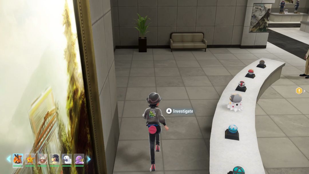 (03) A Spewpa hiding on a pedestal among the Poke Balls.