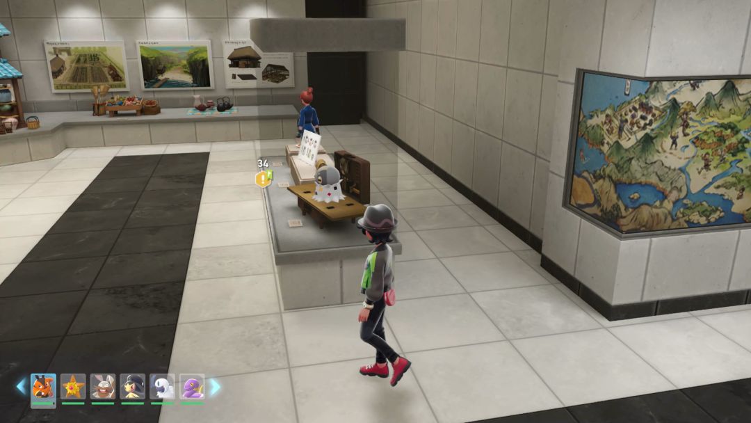 (06) A Spewpa sitting on the crafting bench near the entrance to the second room on the museum's second floor.