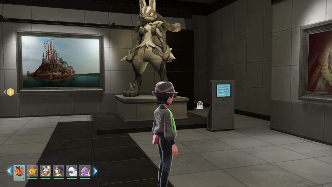 (12) Back on the ground floor, a Spewpa stands in a corner near a Lucario statue.