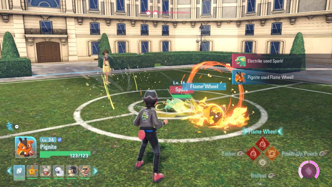 The Pokemon Trainer's hearty Pignite starts to use Flame Wheel as the Electrike rushes it with sparky intent.