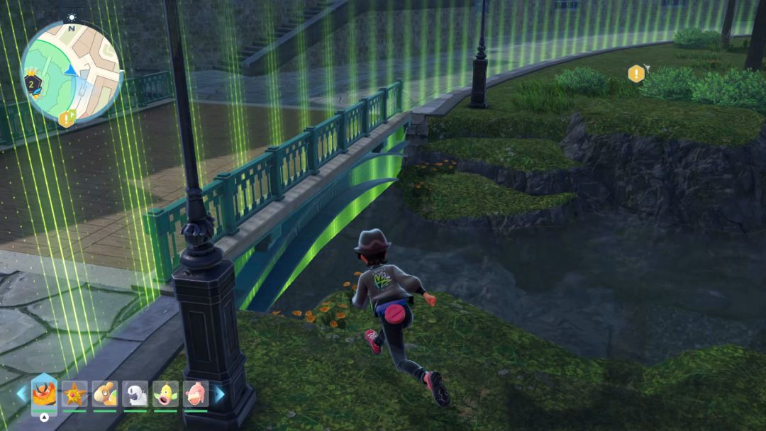 The Pokemon Trainer runs along a grassy bank toward a shallow stream he will cross to reach another grassy area near the northeast portion of Wild Zone 2.