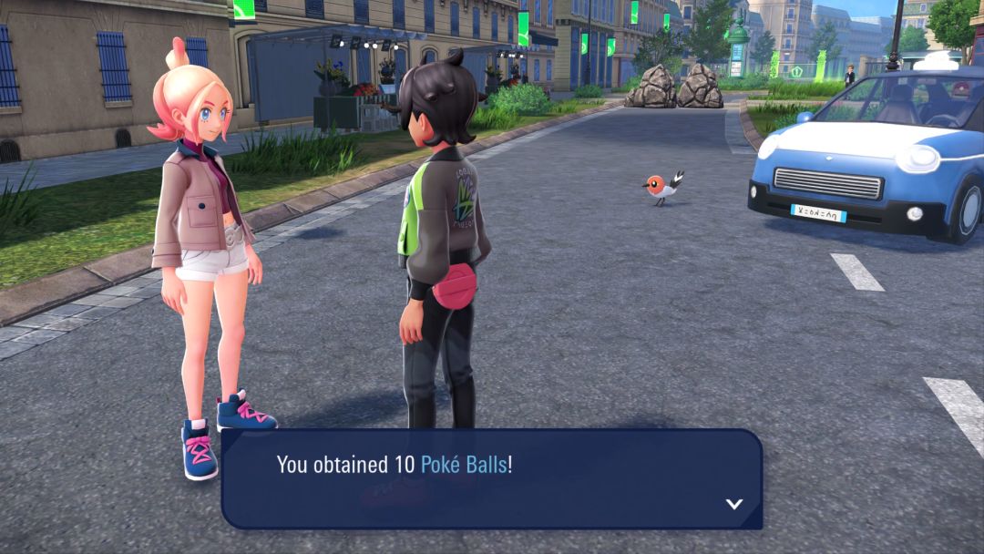 Taunie faces the Pokemon Trainer in the wild zone, after just handing over 10 Poke Balls, while a Fletcling stands near a car in the background.