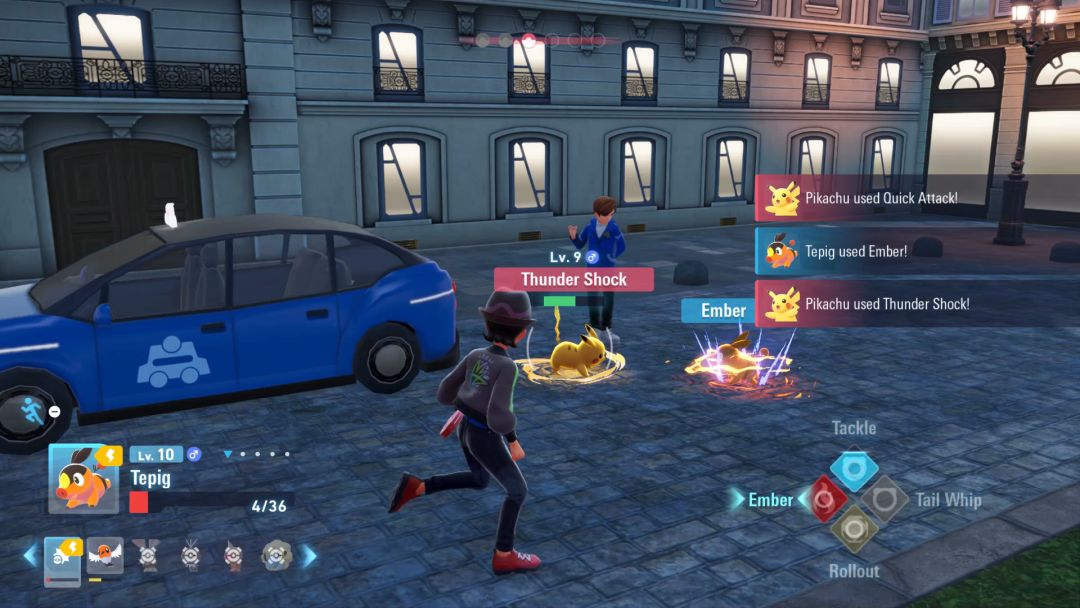 In a parking lot battle, Tepig launches an Ember attack at Pikachu, who is busy countering with its Thunder Shock move.