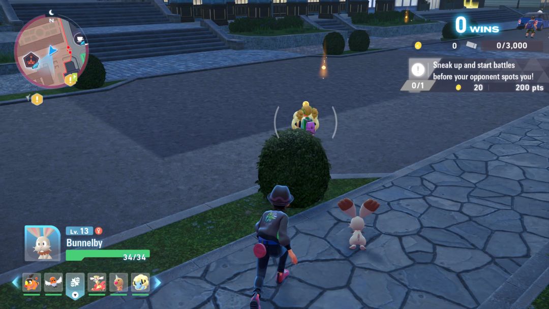 The Pokemon trainer sneaks up behind a rival trainer in the Battle Zone, with a bush in between them, to initiate a surprise attack and gain the advantage.