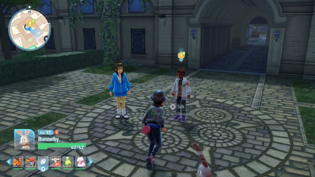 Approaching Naveen in the plaza in front of Hotel Z. Lida stands to his right for moral support.
